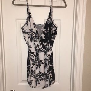 Black & white floral print romper. Skort in front